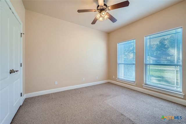 240 Hummingbird Way, Martindale, TX 78655 - unfurnished room with light carpet, baseboards, and ceiling fan