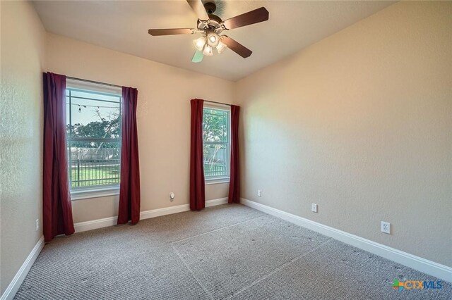 240 Hummingbird Way, Martindale, TX 78655 - spare room featuring healthy amount of natural light, baseboards, and carpet flooring