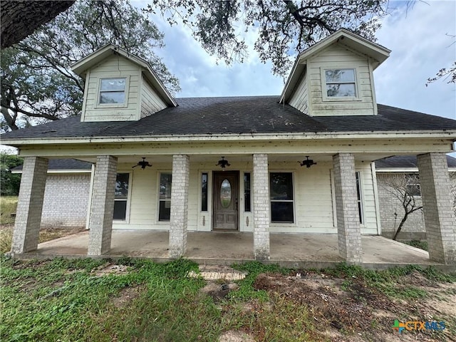 20908 Zac Lentz Pkwy, Victoria, TX 77905 - view of front of property with ceiling fan, a patio, and a shingled roof