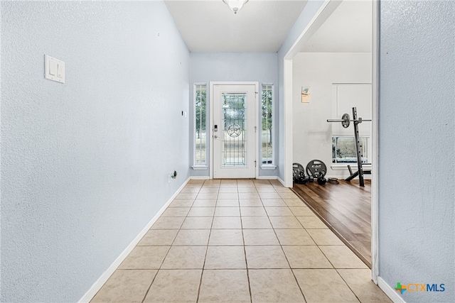 entryway with light hardwood / wood-style floors