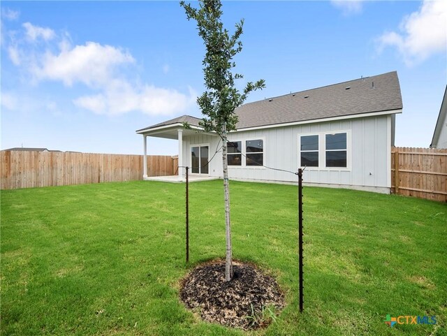 1513 Passmore Downs, New Braunfels, TX 78130 - rear view of house featuring board and batten siding and a shingled roof