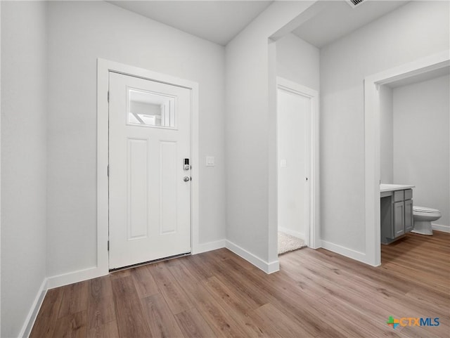 1513 Passmore Downs, New Braunfels, TX 78130 - entrance foyer with light wood-type flooring and baseboards
