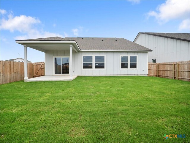 1513 Passmore Downs, New Braunfels, TX 78130 - back of property with a patio, board and batten siding, and roof with shingles
