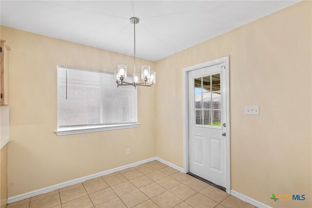 501 Appaloosa Dr, Victoria, TX 77904 - unfurnished dining area featuring a chandelier and light tile patterned flooring