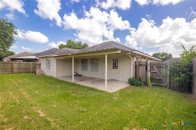 501 Appaloosa Dr, Victoria, TX 77904 - back of house with a patio, a fenced backyard, a gate, and stucco siding
