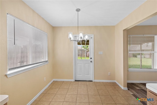 501 Appaloosa Dr, Victoria, TX 77904 - unfurnished dining area with a chandelier and light tile patterned floors
