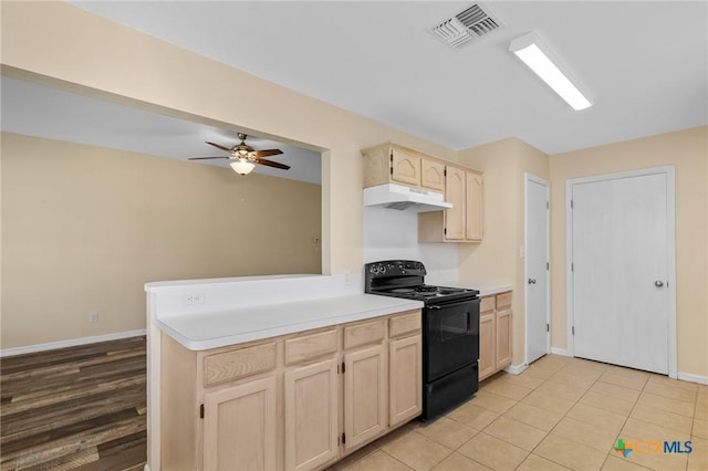 501 Appaloosa Dr, Victoria, TX 77904 - kitchen featuring electric range, under cabinet range hood, light brown cabinetry, and light countertops