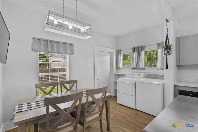 905 N Navarro St, Victoria, TX 77901 - dining room featuring washer and clothes dryer and light wood-style flooring
