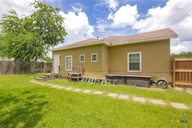 905 N Navarro St, Victoria, TX 77901 - back of property with a fenced backyard and stucco siding