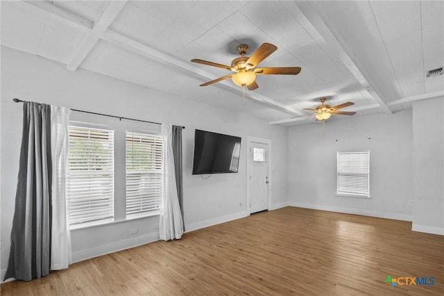 905 N Navarro St, Victoria, TX 77901 - unfurnished living room with wood finished floors, plenty of natural light, beamed ceiling, a ceiling fan, and coffered ceiling