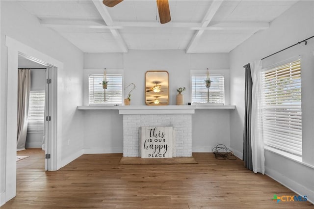 905 N Navarro St, Victoria, TX 77901 - living room featuring a ceiling fan, wood finished floors, beamed ceiling, and healthy amount of natural light