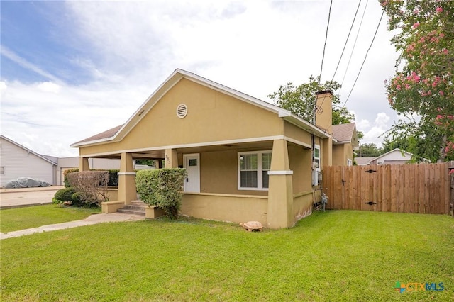 905 N Navarro St, Victoria, TX 77901 - bungalow with stucco siding and a chimney