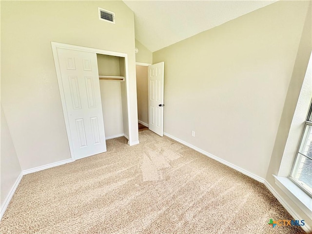 421 Arapaho Dr, Harker Heights, TX 76548 - unfurnished bedroom featuring light carpet, lofted ceiling, baseboards, and a closet