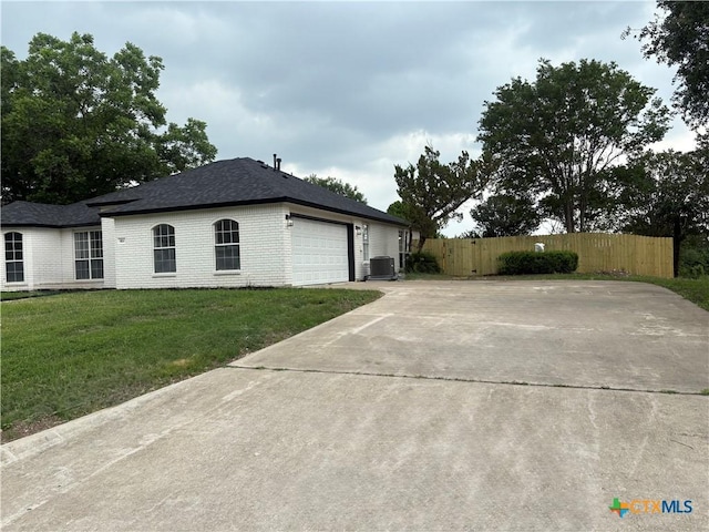 421 Arapaho Dr, Harker Heights, TX 76548 - view of side of home with an attached garage, driveway, brick siding, and cooling unit