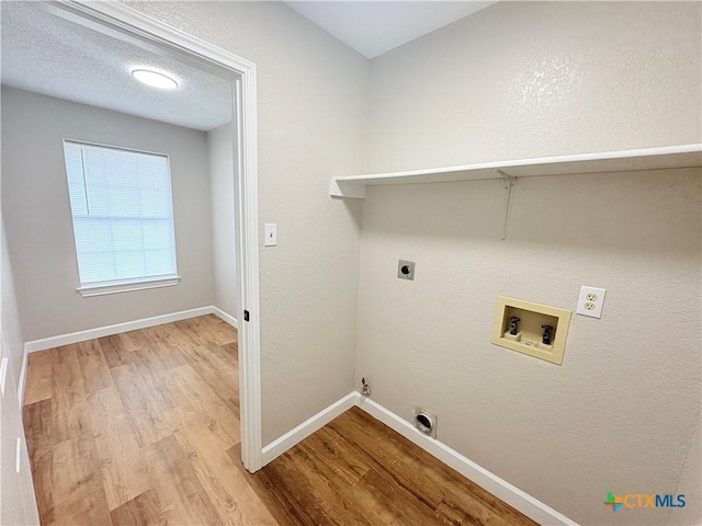 421 Arapaho Dr, Harker Heights, TX 76548 - laundry room featuring hookup for a washing machine, wood finished floors, electric dryer hookup, baseboards, and hookup for a gas dryer