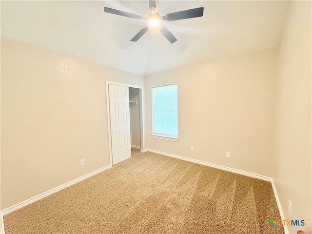 421 Arapaho Dr, Harker Heights, TX 76548 - unfurnished bedroom featuring carpet, baseboards, and vaulted ceiling