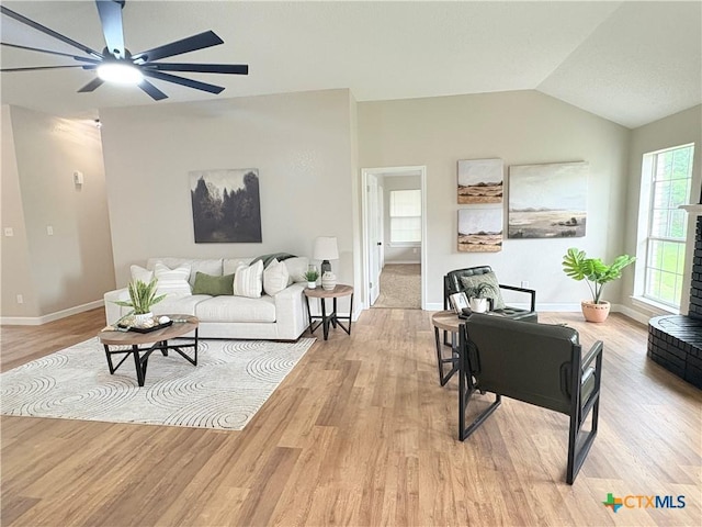 421 Arapaho Dr, Harker Heights, TX 76548 - living area featuring a ceiling fan, lofted ceiling, light wood-type flooring, and baseboards