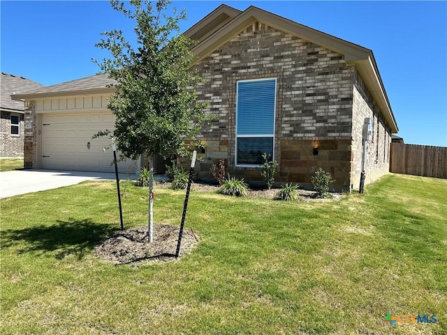 view of front of property with an attached garage, driveway, and brick siding
