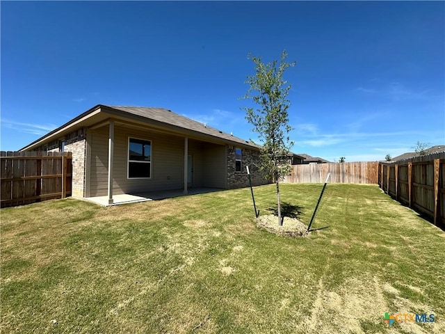 rear view of property featuring a patio