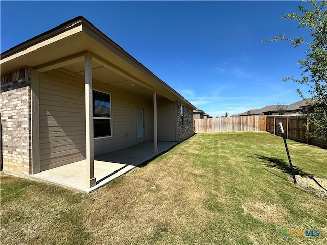 back of property with a patio