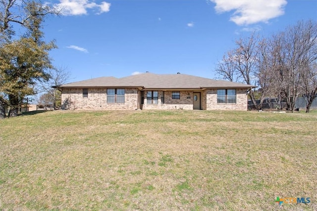 rear view of house with a lawn