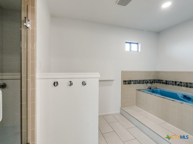 bathroom featuring a garden tub, visible vents, baseboards, a shower stall, and tile patterned floors