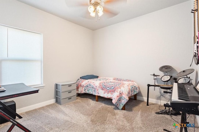 bedroom with carpet floors, ceiling fan, and baseboards