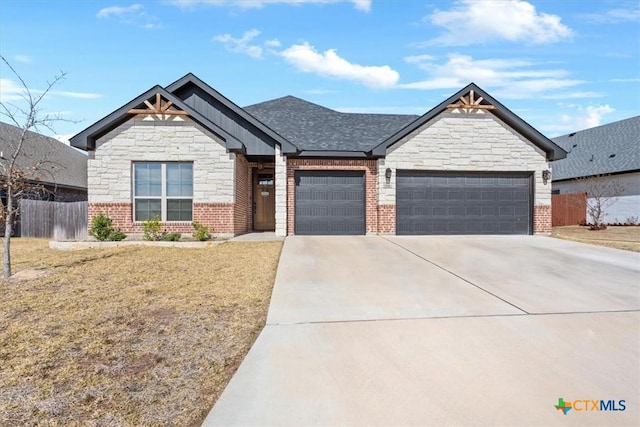 craftsman-style home with an attached garage, brick siding, a shingled roof, fence, and driveway