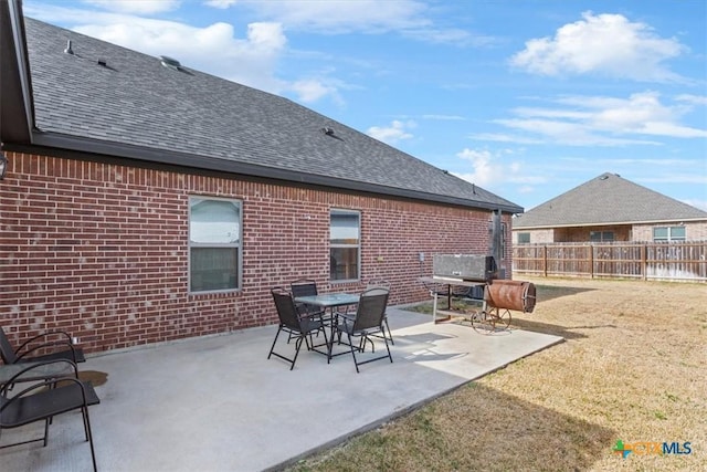 view of patio featuring fence