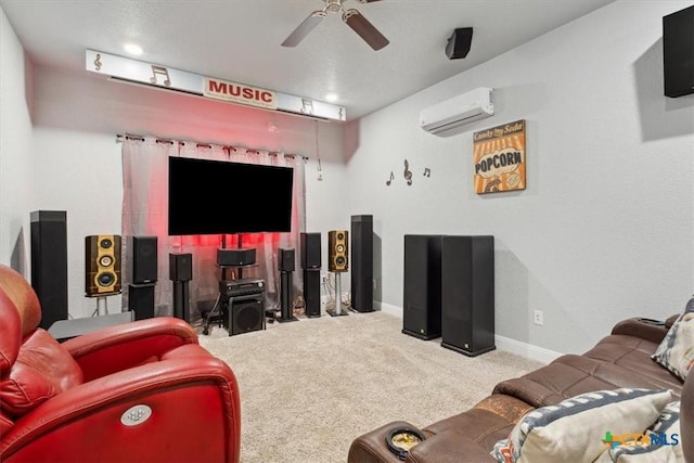 carpeted cinema room featuring a ceiling fan, an AC wall unit, and baseboards