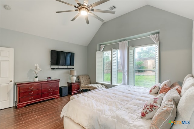 bedroom with dark wood-type flooring, ceiling fan, and vaulted ceiling