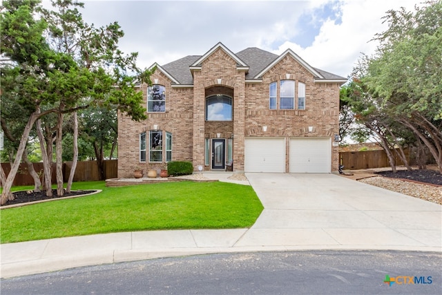 view of front facade featuring a garage and a front yard