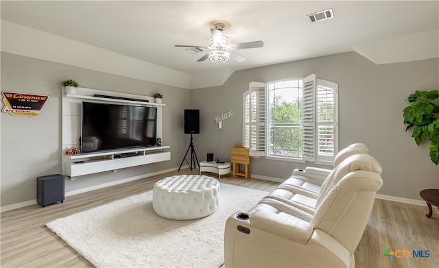 living room with hardwood / wood-style flooring and ceiling fan