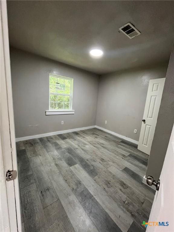 255 Pollard St, Beaumont, TX 77703 - unfurnished room featuring wood finished floors and baseboards