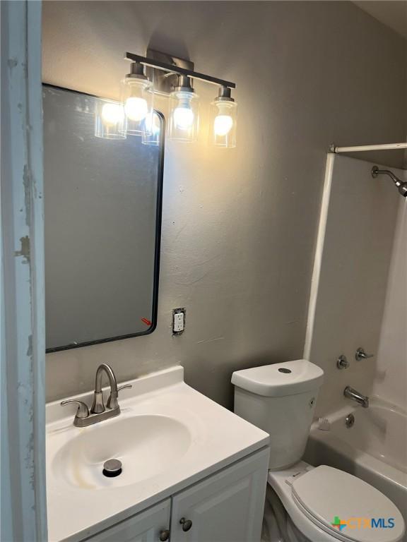 255 Pollard St, Beaumont, TX 77703 - bathroom featuring vanity, toilet, and  shower combination