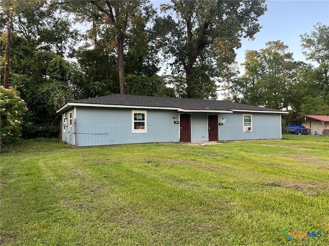 255 Pollard St, Beaumont, TX 77703 - view of front facade featuring a front yard and view of scattered trees