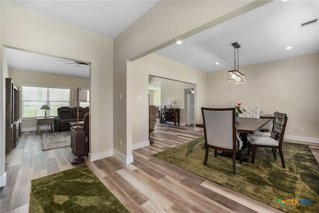 dining area featuring ceiling fan and light hardwood / wood-style floors