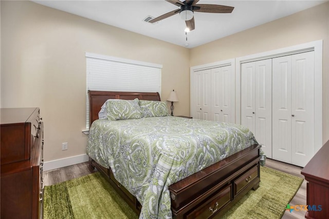 105 N Redfish Retreat Dr, Port Lavaca, TX 77979 - bedroom featuring wood finished floors, multiple closets, baseboards, and a ceiling fan