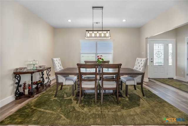 dining area with wood-type flooring