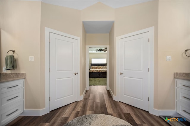 bathroom featuring wood-type flooring, ceiling fan, and vanity