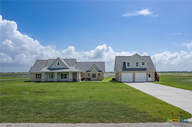 view of front facade featuring a garage, a porch, and a front lawn