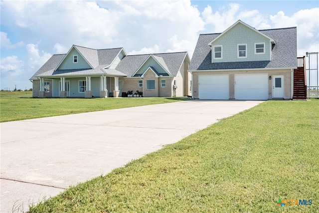 view of front of home featuring a garage and a front yard