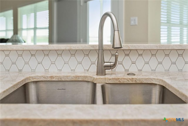 105 N Redfish Retreat Dr, Port Lavaca, TX 77979 - kitchen view of a sink, decorative backsplash, and light countertops