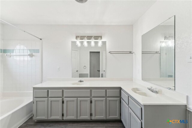 3400 Sally Cir, Kempner, TX 76539 - full bath featuring double vanity, wood finished floors, and tub / shower combination