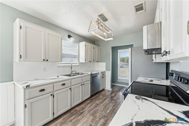 3400 Sally Cir, Kempner, TX 76539 - kitchen featuring a sink, electric stove, stainless steel dishwasher, wood finished floors, and white cabinetry