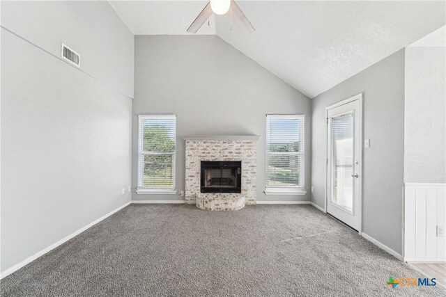3400 Sally Cir, Kempner, TX 76539 - unfurnished living room featuring healthy amount of natural light, a fireplace, a ceiling fan, carpet flooring, and high vaulted ceiling