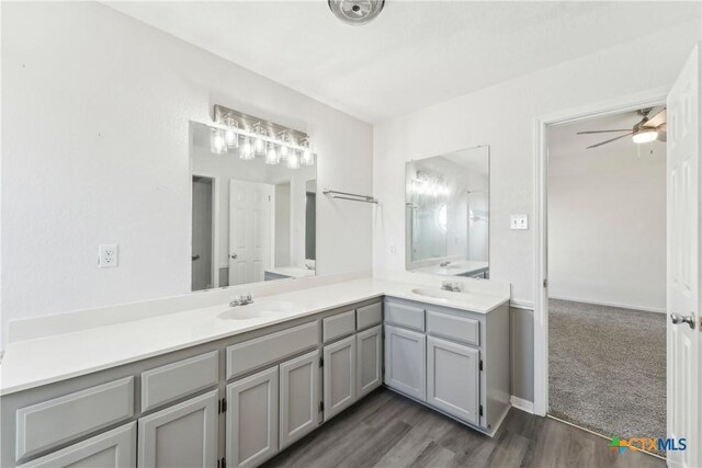 3400 Sally Cir, Kempner, TX 76539 - full bath featuring double vanity, a ceiling fan, and wood finished floors