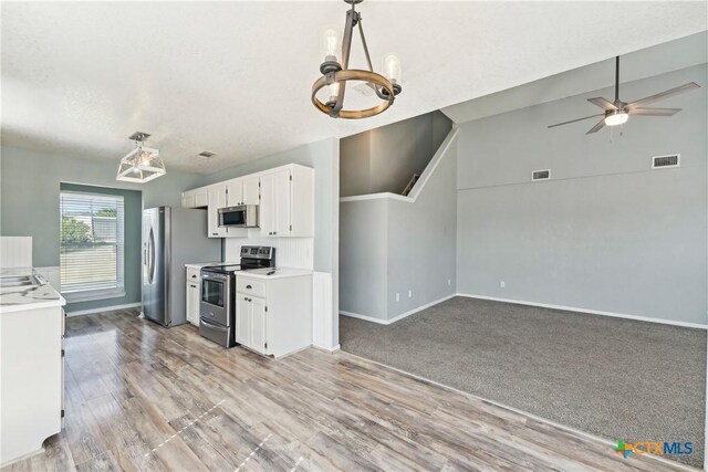 3400 Sally Cir, Kempner, TX 76539 - kitchen with stainless steel appliances, a chandelier, white cabinetry, and light countertops