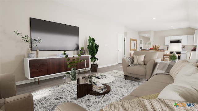 living room featuring hardwood / wood-style floors and vaulted ceiling