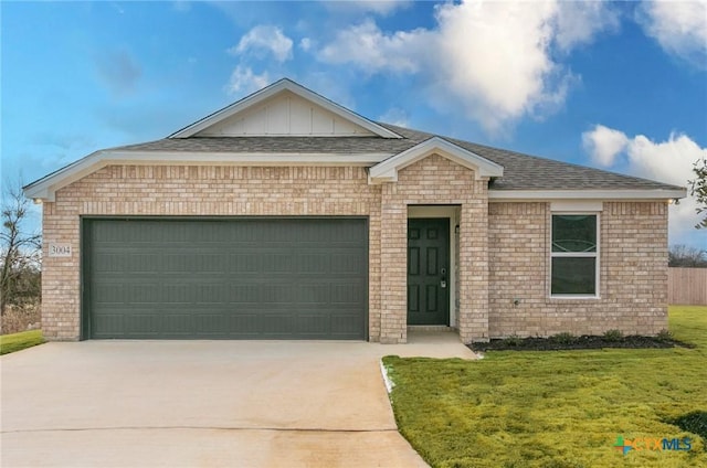 single story home with a garage and a front lawn